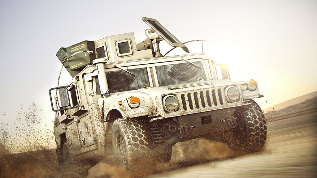 An armoured military vehicle driving across the desert