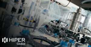 A manufacturing production line creating water bottles with robotics - including the HIPER Global logo